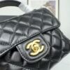 693043f3f09edb6de4c4db79 CHANEL 25P New Handle Top Handle Bag Mini in Black and Gold Lambskin