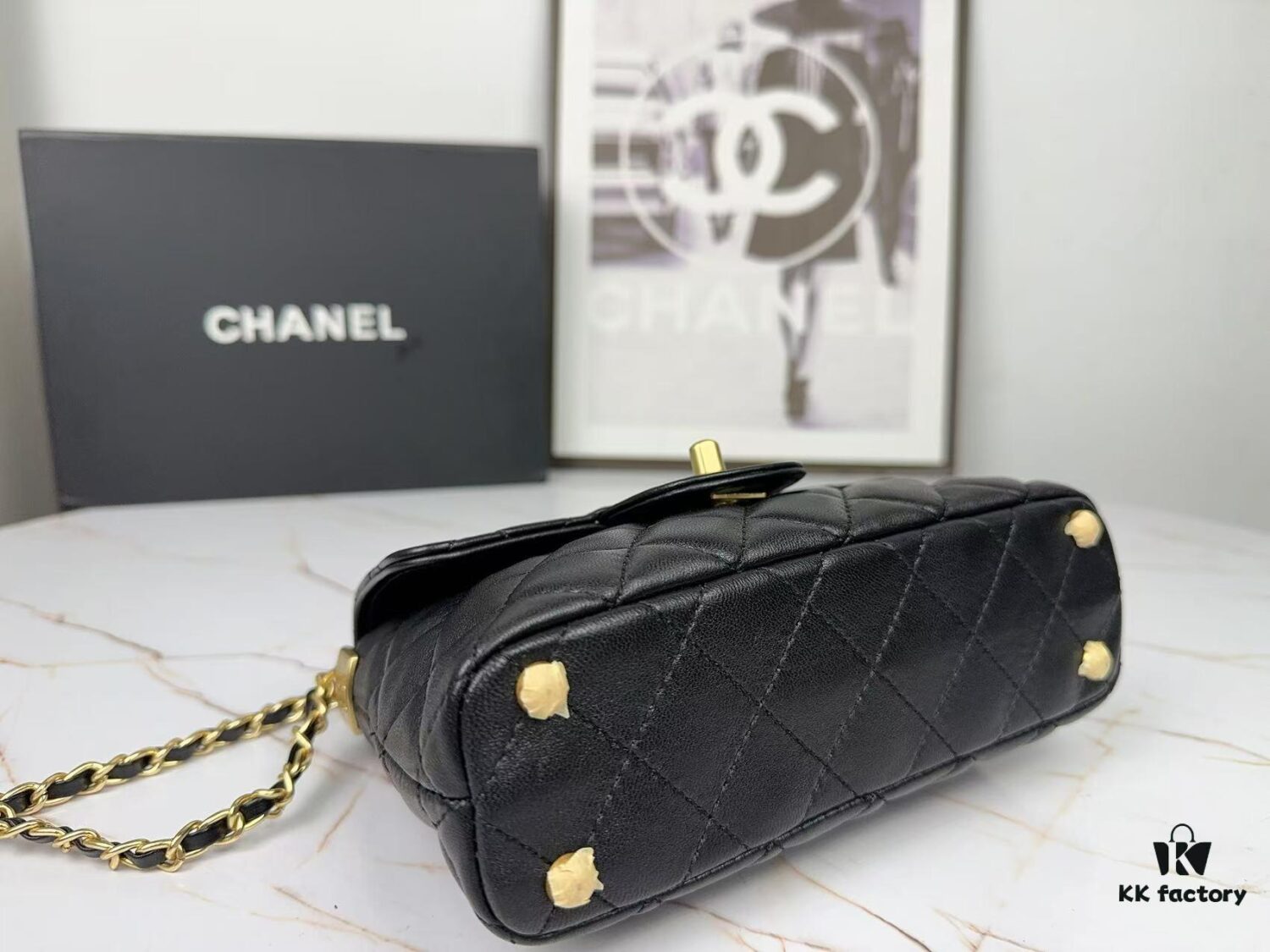 693043f4f09edb6de4c4db7b CHANEL 25P New Handle Top Handle Bag Mini in Black and Gold Lambskin