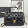 69304406f09edb6de4c4db8d CHANEL 25P New Handle Top Handle Bag Mini in Black and Gold Lambskin