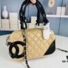 69304535f09edb6de4c4dd42 New Arrival Vintage Charm | Chanel Classic Mini Handbag in Black and White Quilted Design