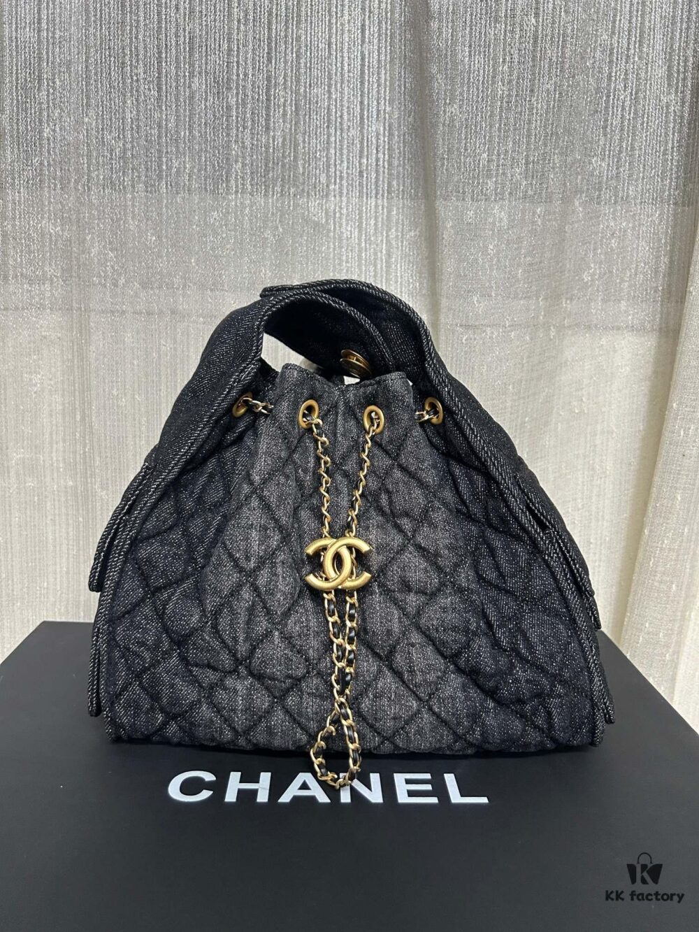 693047e9f09edb6de4c4e009 Chanel Washed Denim 25C Hobo Bag with Quilted Ball Texture, Vintage Coin Button Drawstring Bucket Bag in Retro Black and Gold with Diamond Stitching, Classic Chain Design