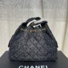 693047ebf09edb6de4c4e00b Chanel Washed Denim 25C Hobo Bag with Quilted Ball Texture, Vintage Coin Button Drawstring Bucket Bag in Retro Black and Gold with Diamond Stitching, Classic Chain Design