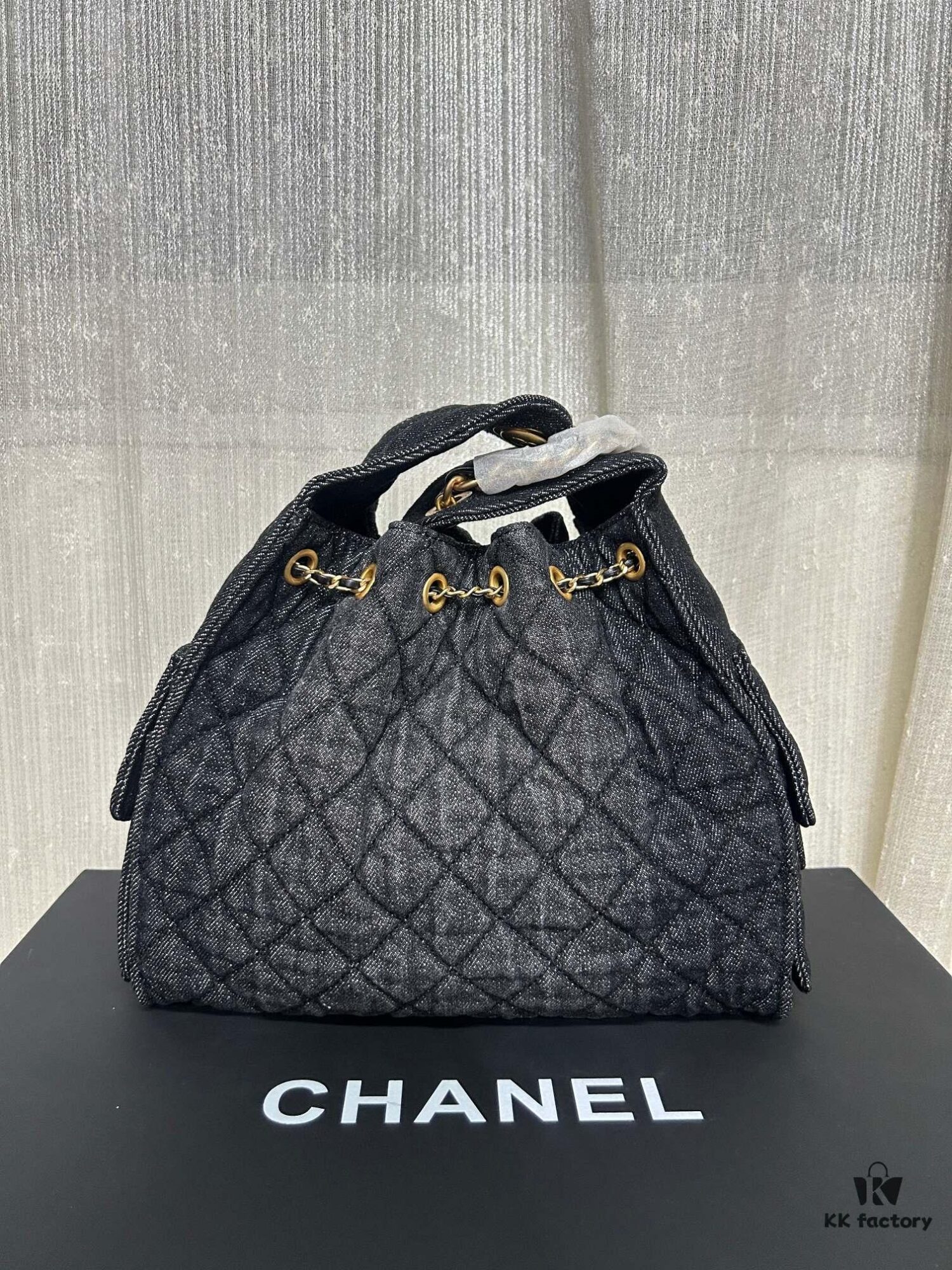693047ebf09edb6de4c4e00b Chanel Washed Denim 25C Hobo Bag with Quilted Ball Texture, Vintage Coin Button Drawstring Bucket Bag in Retro Black and Gold with Diamond Stitching, Classic Chain Design