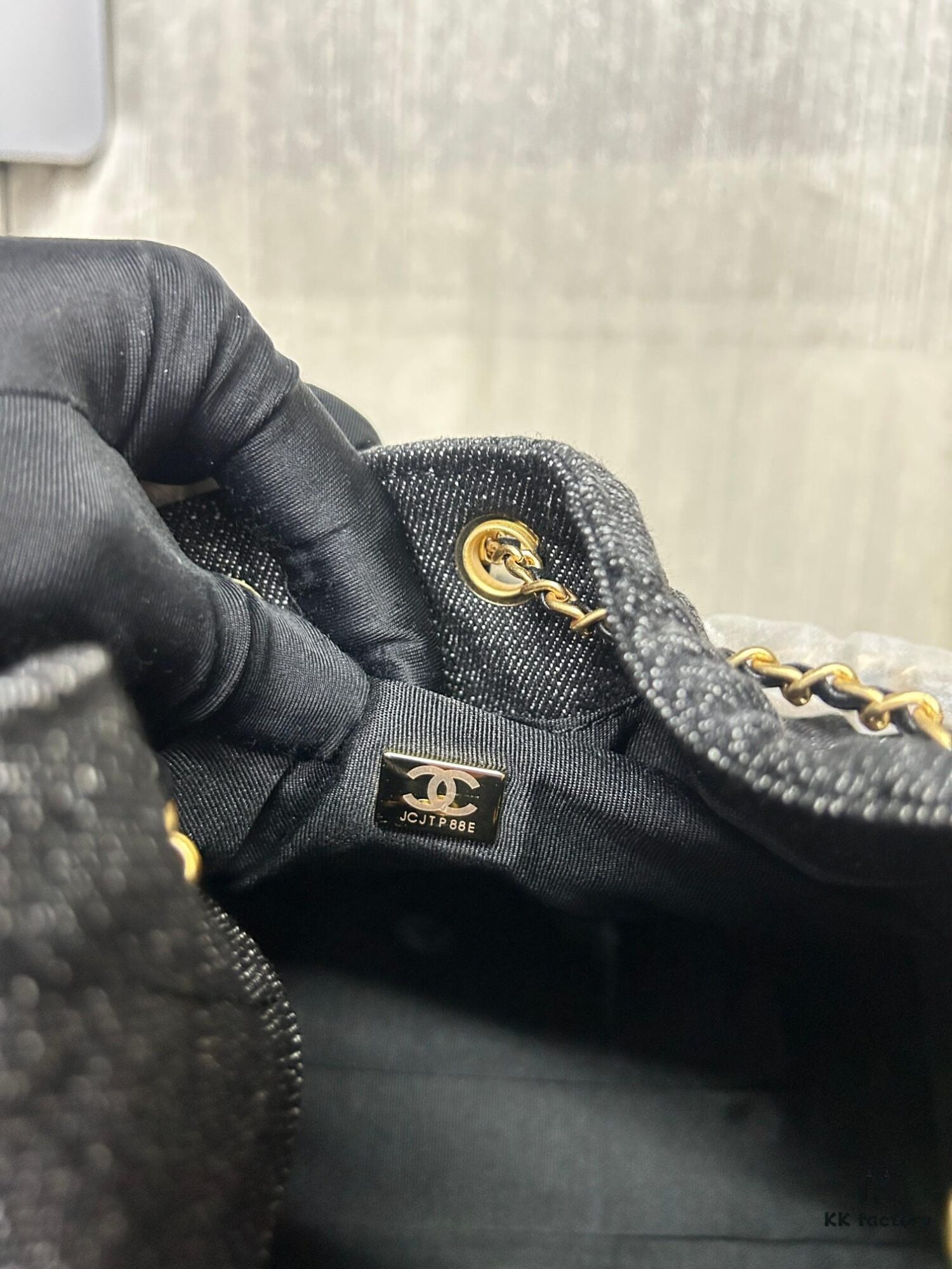 693047f1f09edb6de4c4e00d Chanel Washed Denim 25C Hobo Bag with Quilted Ball Texture, Vintage Coin Button Drawstring Bucket Bag in Retro Black and Gold with Diamond Stitching, Classic Chain Design