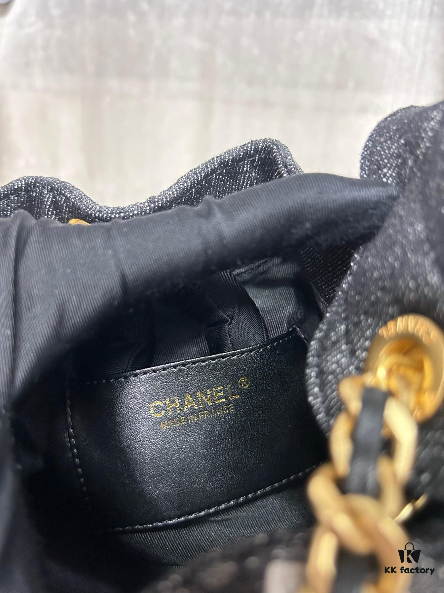693047f2f09edb6de4c4e00e Chanel Washed Denim 25C Hobo Bag with Quilted Ball Texture, Vintage Coin Button Drawstring Bucket Bag in Retro Black and Gold with Diamond Stitching, Classic Chain Design