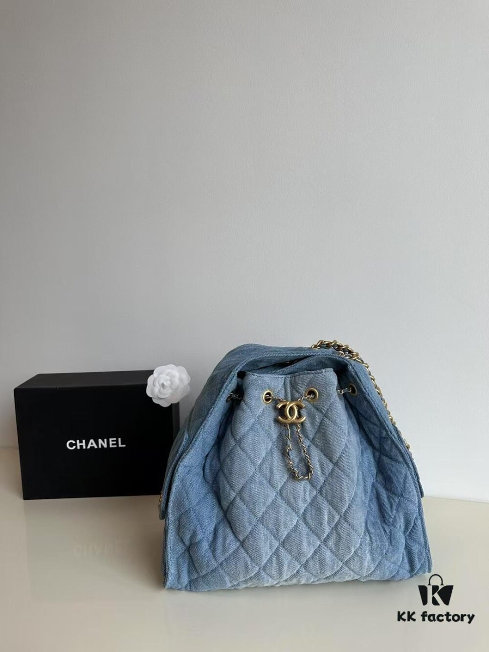 693047f5f09edb6de4c4e011 Chanel Washed Denim 25C Hobo Bag with Quilted Ball Texture, Vintage Coin Buckle Drawstring Bucket Bag in Retro Black and Gold with Diamond Stitching and Classic Chain Design