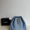 693047f5f09edb6de4c4e011 Chanel Washed Denim 25C Hobo Bag with Quilted Ball Texture, Vintage Coin Buckle Drawstring Bucket Bag in Retro Black and Gold with Diamond Stitching and Classic Chain Design