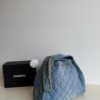 693047f9f09edb6de4c4e014 Chanel Washed Denim 25C Hobo Bag with Quilted Ball Texture, Vintage Coin Buckle Drawstring Bucket Bag in Retro Black and Gold with Diamond Stitching and Classic Chain Design