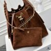 69304d67f09edb6de4c4e798 Large Upgraded Chanel 25C Hobo Bag in Suede Leather - Vintage Gold Buckle Drawstring Bucket Bag with Quilted Pattern, Retro Black and Gold, Classic Chain Design