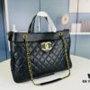 69304f99f09edb6de4c4ea58 New Arrival Chanel Black and Gold 2-Way Vertical Tote