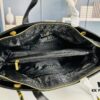 69304f9bf09edb6de4c4ea5a New Arrival Chanel Black and Gold 2-Way Vertical Tote