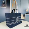693051e5f09edb6de4c4ed69 Large New Arrival CHANEL Navy Striped Denim Beach Tote – The Perfect Companion for Vacation and Everyday Elegance