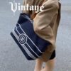 693051f1f09edb6de4c4ed79 Large New Arrival CHANEL Navy Striped Denim Beach Tote Bag