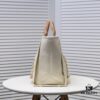 69305300f09edb6de4c4eef5 Chanel Tote Bag - Striped Canvas Beach Shopping Bag with Chain, Resort Style for Spring and Summer