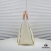 6930530ff09edb6de4c4ef0b Chanel Tote Bag Spring and Summer Resort Style Canvas Beach Bag with Chain Stripes