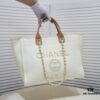 69305311f09edb6de4c4ef0f Chanel Tote Bag Spring and Summer Resort Style Canvas Beach Bag with Chain Stripes
