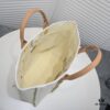 69305313f09edb6de4c4ef11 Chanel Tote Bag Spring and Summer Resort Style Canvas Beach Bag with Chain Stripes