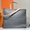 69305948f09edb6de4c4f885 M24457 M24475 This Medium Shopper Handbag Draws Inspiration from Louis Vuitton's Shopping Tote