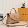 69305967f09edb6de4c4f8b8 Exclusive Real Photo - Upgraded Version ‼️⭐️ M21720 Black, M21797 White ⭐️ This Hold Me Handbag is a new addition to Louis Vuitton's iconic New Wave quilted leather goods collection, featuring a refined silhouette and comfortable carry. The smooth-textured body is accented with an elegant LV metal clasp. The detachable and adjustable leather strap enhances the bag’s versatility.