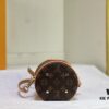 Upgraded Original Version [Exclusive Real Photo M82952 Monogram Yellow Flower] This Nano Cannes Handbag features a cylindrical silhouette crafted from Monogram canvas, echoing the design of a makeup pouch.