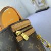 Upgraded Original Version [Exclusive Real Photo M82952 Monogram. Yellow Flower] This Nano Cannes Handbag features a cylindrical silhouette crafted from Monogram canvas, echoing the design of a makeup pouch.