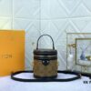 Upgraded Original Version [Exclusive Real Photo M82952 Monogram. Yellow Flower] This Nano Cannes Handbag features a cylindrical silhouette cut from Monogram canvas, echoing the design of a makeup pouch.