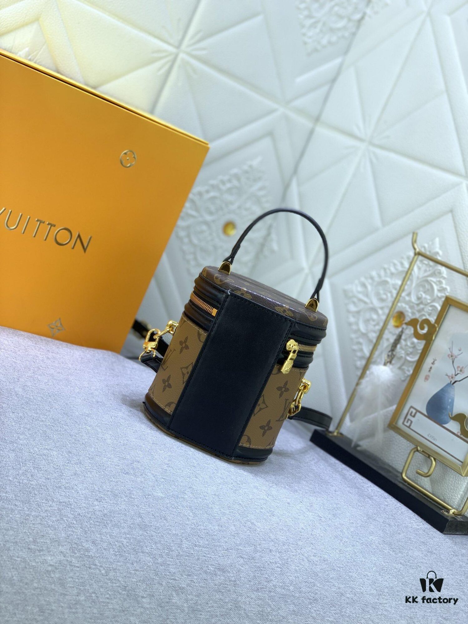 Upgraded Original Version [Exclusive Real Photo M82952 Monogram. Yellow Flower] This Nano Cannes Handbag features a cylindrical silhouette cut from Monogram canvas, echoing the design of a makeup pouch.