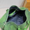 69305b42f09edb6de4c4fbc5 Louis Vuitton Keepall Bandoulière 41 in Taurillon Illusion Leather