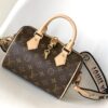 M46222 Beige M46234 Black [M45957 Black Adjustable Strap Not Available] ~ This Speedy Bandoulière 20 Handbag is crafted from Monogram canvas with cowhide leather trim and textile lining, continuing the iconic Louis Vuitton Speedy travel bag design in a compact size, featuring rolled leather handles and a detachable, adjustable fabric shoulder strap accented with signature woven branding details