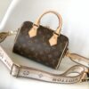 M46222 Beige M46234 Black [M45957 Black Adjustable Strap Not Available] ~ This Speedy Bandoulière 20 Handbag features Monogram canvas, cowhide leather trim, and textile lining, continuing the classic Louis Vuitton Speedy travel bag design in a compact size, complete with rolled leather handles and a detachable, adjustable fabric shoulder strap accented with signature woven branding