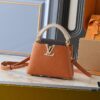 69305e0ff09edb6de4c500c2 Guangzhou Goods Upgraded Original Version M12956 M12952 M14176 This Mini Capucines Handbag in Elegant Taurillon Calfskin with Shiny Metal Hardware and LV Letter Accent