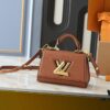 69305ed9f09edb6de4c5025a Upgraded Original M21590 M59090 Twist One Handle BB Handbag crafted from deeply dyed Taurillon leather, featuring a top single handle and the iconic LV Twist turn-lock flap closure. The contrasting color leather lining adds a fashionable touch, suitable for crossbody, shoulder, or handheld wear.