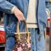 69305fbdf09edb6de4c50450 M81489 Lv Village Cherry Blossom Upgraded Nano Bucket Bag from Match Collection