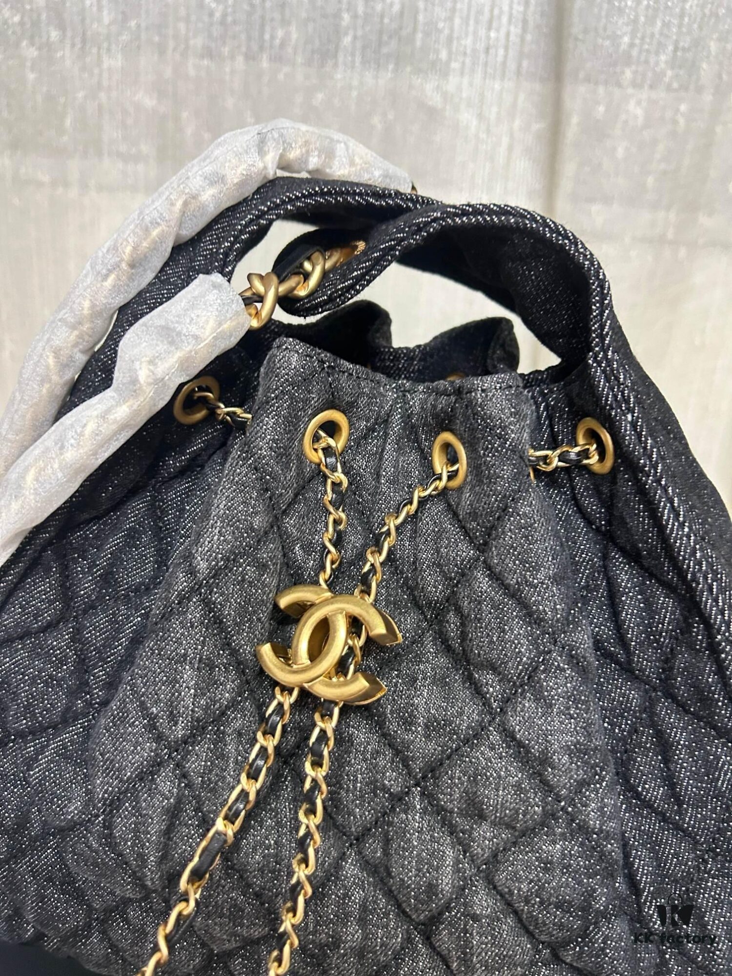 693064416e68136f4d9a4446 Chanel Washed Denim 25C Hobo Bag with Quilted Ball Texture, Vintage Coin Button Drawstring Bucket Bag in Retro Black and Gold with Diamond Stitching, Classic Chain Design