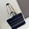 6930646e6e68136f4d9a4478 Small-sized New Arrival CHANEL Navy Blue Striped Denim Beach Tote Bag