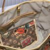 693066996e68136f4d9a48a8 M45865 M40995 This Neverfull Medium Handbag is crafted from Monogram Tiles canvas in a tote silhouette, accented with leather trim that defines the top and handles. The central LV Circle signature pairs playfully with the watercolor-effect Monogram pattern, while the printed zip pouch can be removed for separate use.