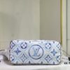 M24317 M40995 This Medium Neverfull Tote Bag Features a Monogram Tiles Canvas Construction with Leather-Trimmed Top and Handles