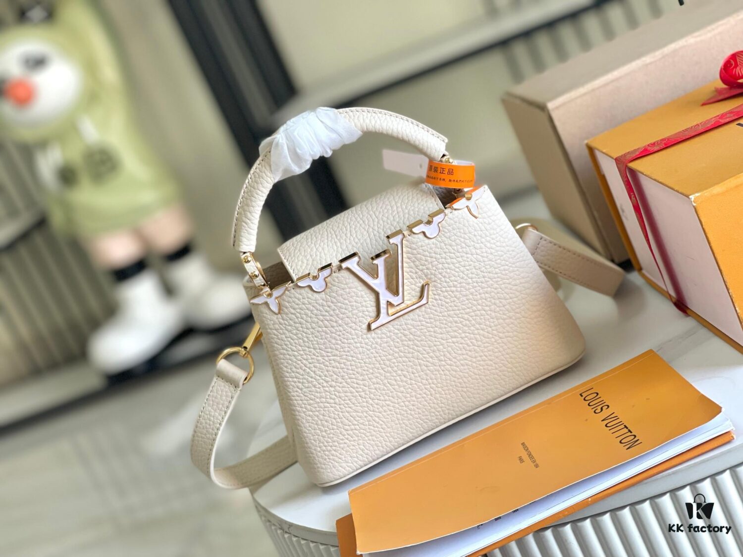 6930691b6e68136f4d9a4cb4 Capucines Mini Handbag with Detachable Strap, Full-Grain Taurillon Leather with Monogram Flowers and Mother-of-Pearl Details