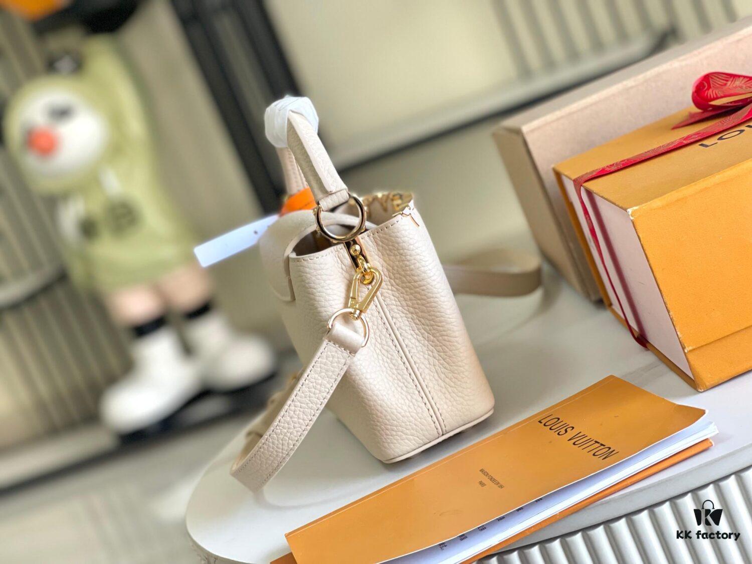 6930691d6e68136f4d9a4cb8 Capucines Mini Handbag with Detachable Strap, Full-Grain Taurillon Leather with Monogram Flowers and Mother-of-Pearl Details