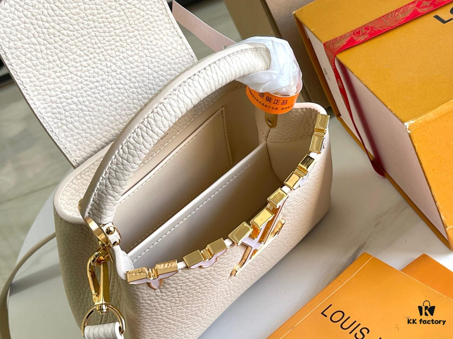 6930691e6e68136f4d9a4cb9 Capucines Mini Handbag with Detachable Strap, Full-Grain Taurillon Leather with Monogram Flowers and Mother-of-Pearl Details
