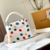 69306d616e68136f4d9a5494 Upgraded M21663 This LV x YK Capucines Small Handbag is from the Louis Vuitton x Yayoi Kusama collaboration collection. The renowned Japanese artist, captivated by polka dots since childhood and viewing them as a symbol of infinity, vividly expresses this motif through 3D hand-painted polka dot prints on supple Taurillon leather.