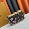 69306f376e68136f4d9a573e M13666 Pochette Accessoires Bag – A playful interpretation of the iconic Monogram canvas with Takashi Murakami's vibrant Cherry Blossom motif, revisiting the Louis Vuitton x Murakami collaboration with bold, whimsical style.