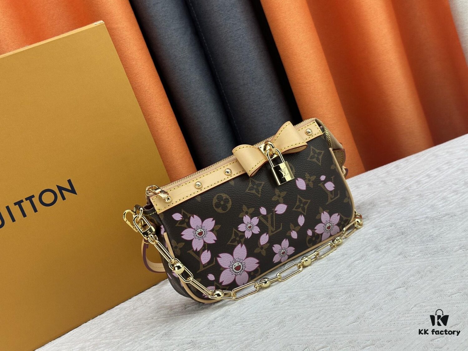69306f376e68136f4d9a573e M13666 Pochette Accessoires Bag – A playful interpretation of the iconic Monogram canvas with Takashi Murakami's vibrant Cherry Blossom motif, revisiting the Louis Vuitton x Murakami collaboration with bold, whimsical style.