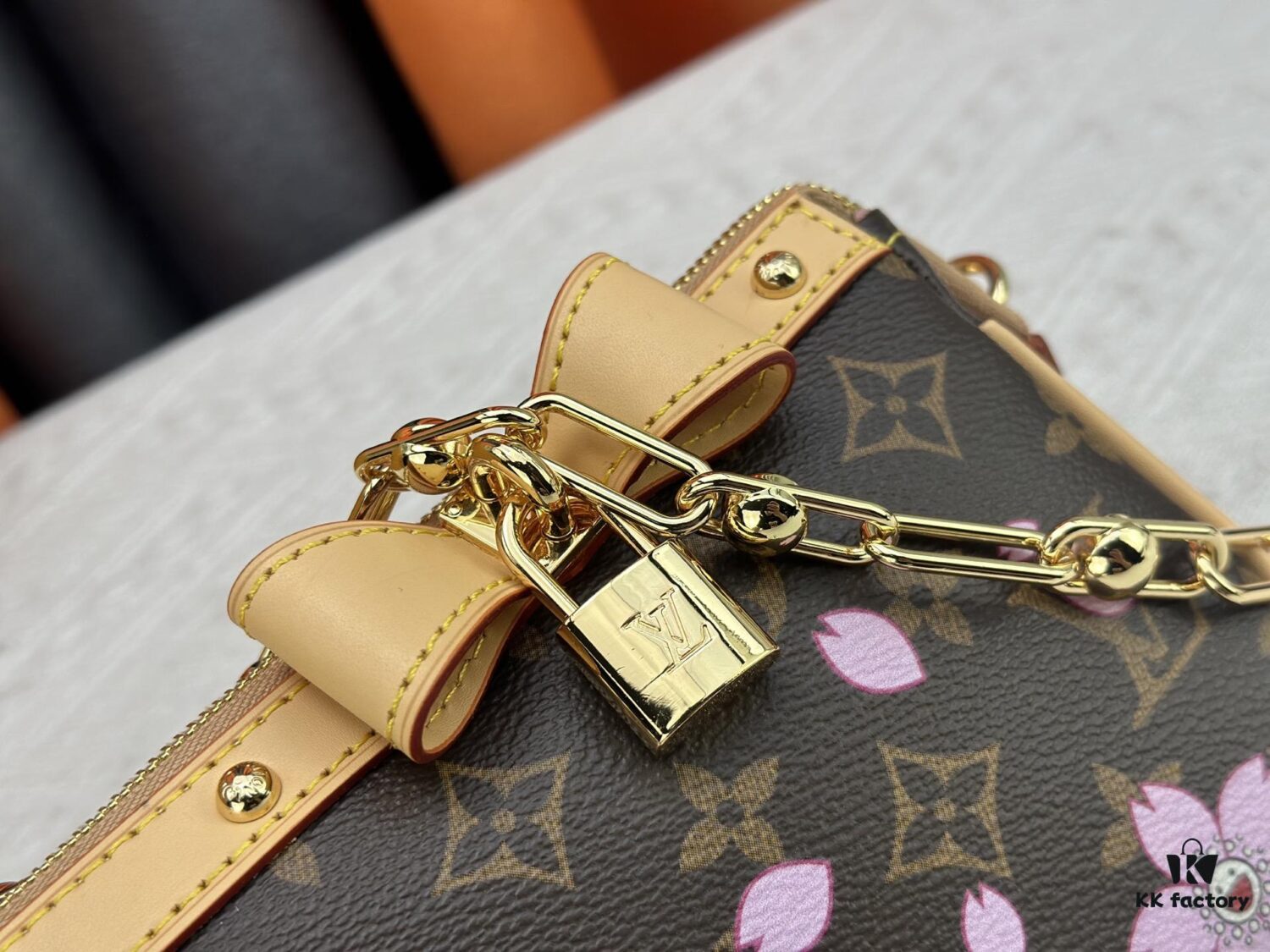 69306f3a6e68136f4d9a5741 M13666 Pochette Accessoires Bag – A playful interpretation of the iconic Monogram canvas with Takashi Murakami's vibrant Cherry Blossom motif, revisiting the Louis Vuitton x Murakami collaboration with bold, whimsical style.