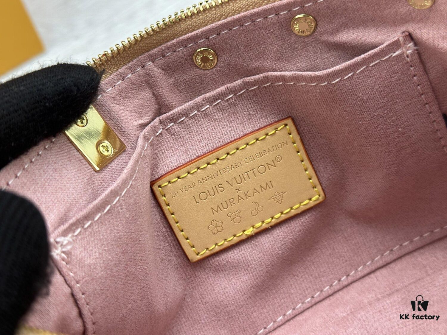 69306f3d6e68136f4d9a5744 M13666 Pochette Accessoires Bag – A playful interpretation of the iconic Monogram canvas with Takashi Murakami's vibrant Cherry Blossom motif, revisiting the Louis Vuitton x Murakami collaboration with bold, whimsical style.