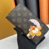 69306fe36e68136f4d9a583d Wallet M60017 Umbrella M80857 M81544 This collectible multicolored zip-around wallet is crafted from Monogram canvas from the Vivienne Holidays 2022 collection, featuring an exquisite print of Louis Vuitton's mascot Vivienne standing in front of the brand's avant-garde Tokyo boutique with Japan's iconic Mount Fuji in the background. This vibrant high-end wallet serves as an invitation to journey and makes a perfect gift.
