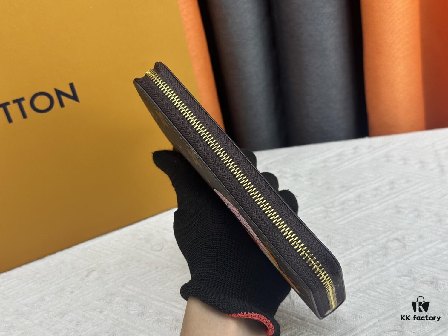 69306fe66e68136f4d9a5840 Wallet M60017 Umbrella M80857 M81544 This collectible multicolored zip-around wallet is crafted from Monogram canvas from the Vivienne Holidays 2022 collection, featuring an exquisite print of Louis Vuitton's mascot Vivienne standing in front of the brand's avant-garde Tokyo boutique with Japan's iconic Mount Fuji in the background. This vibrant high-end wallet serves as an invitation to journey and makes a perfect gift.