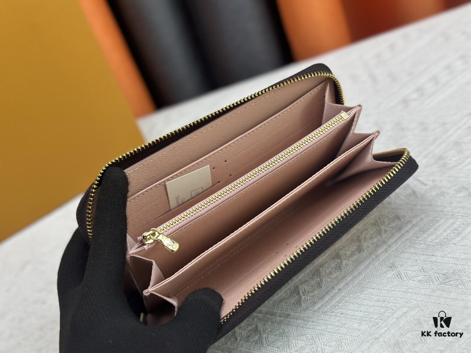 69306fe86e68136f4d9a5849 Wallet M60017 Umbrella M80857 M81544 This collectible multicolored zip-around wallet is crafted from Monogram canvas from the Vivienne Holidays 2022 collection, featuring an exquisite print of Louis Vuitton's mascot Vivienne standing in front of the brand's avant-garde Tokyo boutique with Japan's iconic Mount Fuji in the background. This vibrant high-end wallet serves as an invitation to journey and makes a perfect gift.