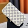 693070ef6e68136f4d9a5a1f Wallet M82839 White Check This collectible multi-compartment zip wallet is crafted from Monogram canvas from the Vivienne Holidays 2022 collection, featuring a delicate print of Vivienne, Louis Vuitton's mascot, standing in front of the brand's avant-garde Tokyo boutique with Japan's iconic Mount Fuji in the background. This vibrant high-end wallet feels like an invitation to travel and makes a perfect gift.