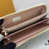 693070f16e68136f4d9a5a24 Wallet M82839 White Check This collectible multi-compartment zip wallet is crafted from Monogram canvas from the Vivienne Holidays 2022 collection, featuring a delicate print of Vivienne, Louis Vuitton's mascot, standing in front of the brand's avant-garde Tokyo boutique with Japan's iconic Mount Fuji in the background. This vibrant high-end wallet feels like an invitation to travel and makes a perfect gift.